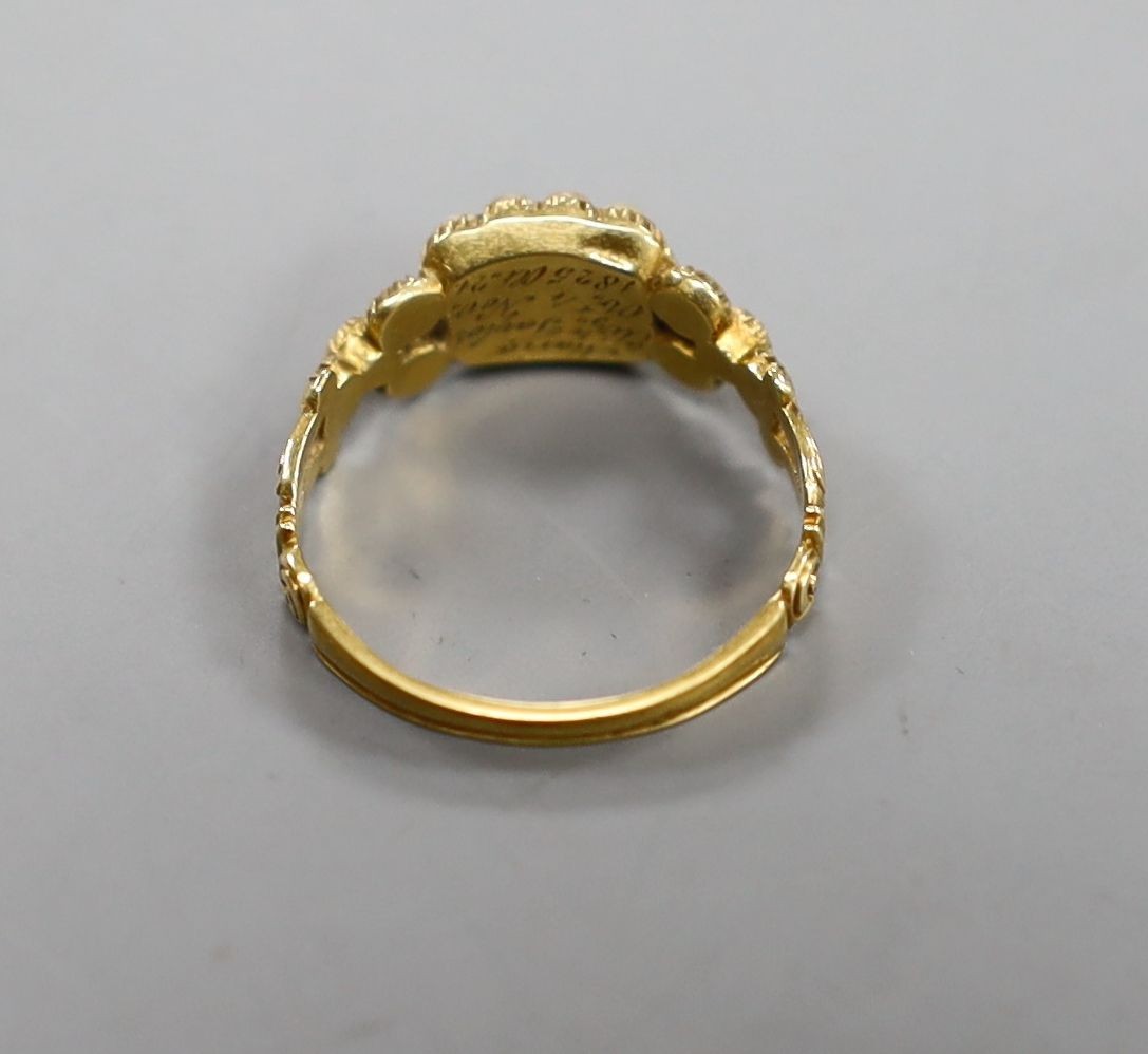 A George IV yellow metal and seed pearl set mourning ring(a.f.), with engraved inscription, 'Marion Eliz. Taylor, Obt. 4th Nov, 1825 at. 21', size O, gross weight 3 grams.